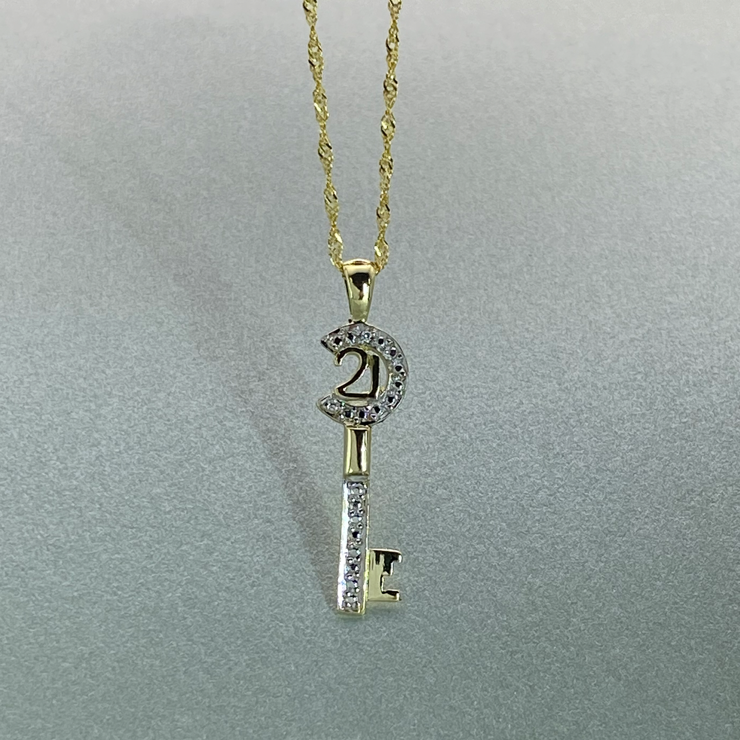 9ct Gold 21 Key Pendant with Cubic Zirconia, Including 9ct bonded chain