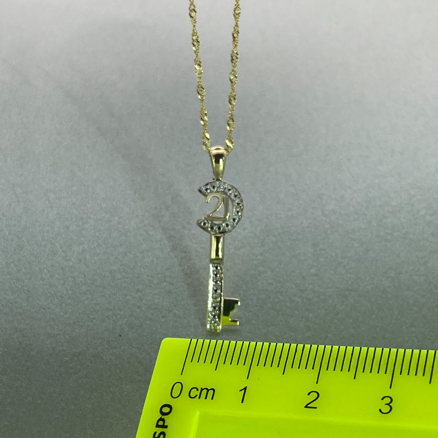 9ct Gold 21 Key Pendant with Cubic Zirconia, Including 9ct bonded chain