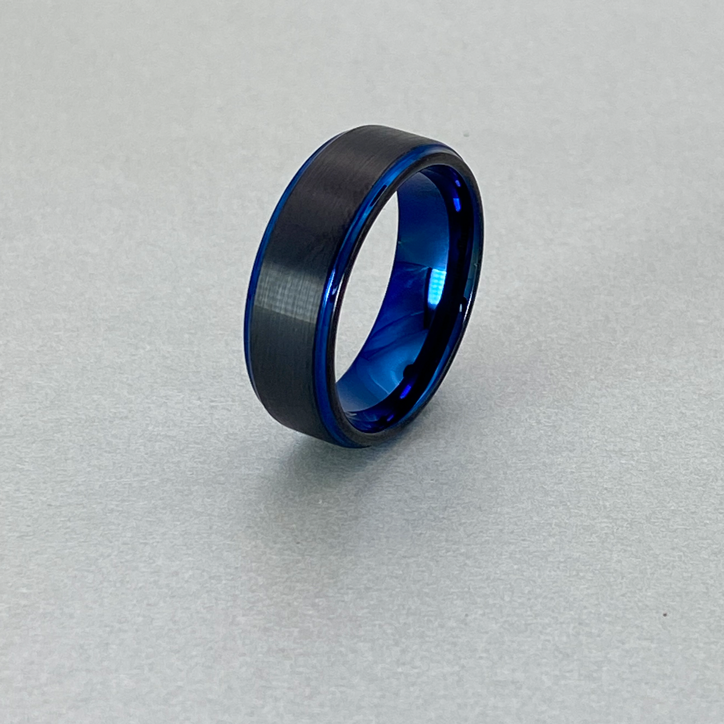 Tungsten Ring , Inside and Edge with Polished Shiny Blue Plating , and center Strip Brushed IP Black Plating.