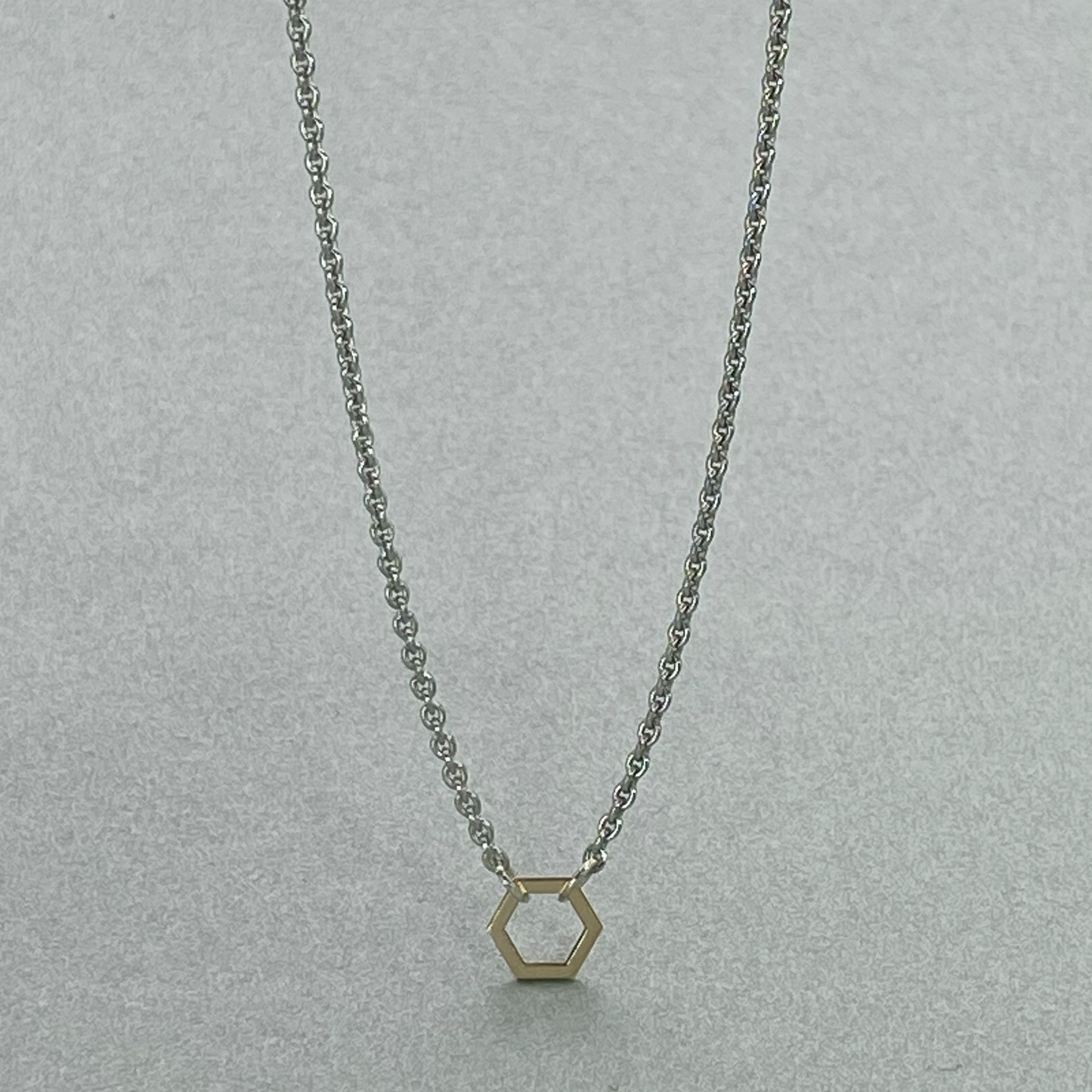 9ct Yellow Gold Hexagon on 43cm Silver Chain