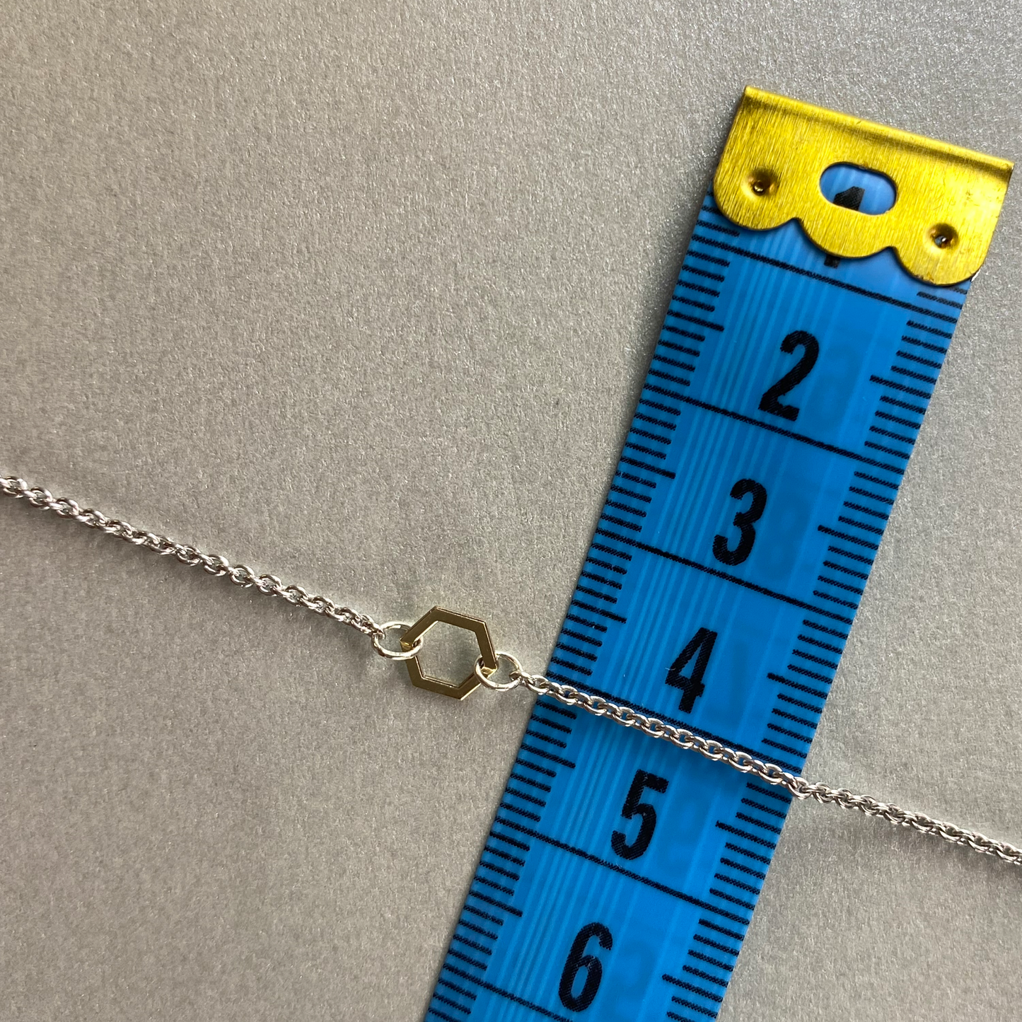 9ct Yellow Gold Hexagon on 43cm Silver Chain