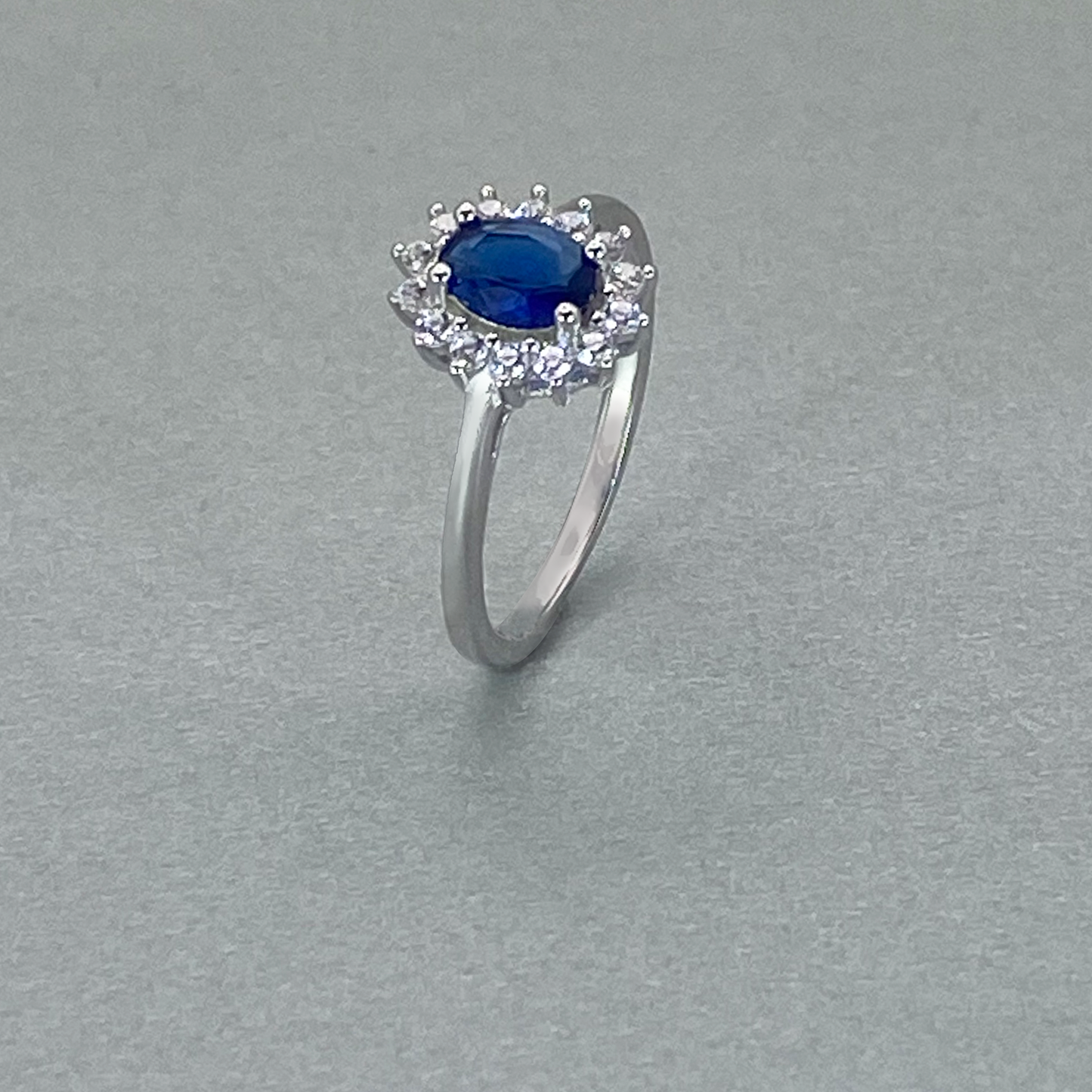 Silver CZ Blue Oval Centre Stone Cluster Ring